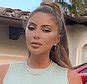 Larsa Pippen sunbathes topless in a thong and wears。